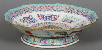 A 19th century Cantonese famille rose porcelain low tazza
Of lobed footed form,