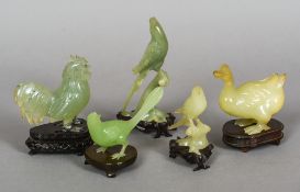 Five various carved jade birds
Each naturalistically modelled and mounted on a carved wooden plinth