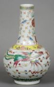 A Chinese porcelain vase
Decorated with a phoenix and dragon interspersed with stylised clouds,