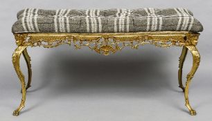 A brass framed upholstered stool
The drop-in seat above the pierced scrolling frieze,