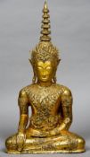 A large gilt bronze model of Buddha
Modelled seated in the lotus position.  85 cm high.