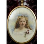An unmarked yellow metal framed portrait miniature of a young girl
Wearing a spray of flowers,