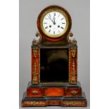 A 19th century French ormolu mounted faux tortoiseshell and ebonised drum head mantle clock by