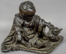 A large Japanese bronze model of a young boy playing with a kitten
Naturalistically modelled,