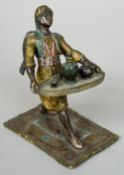 A cold painted bronze figure of a North African man serving tea
The underside inscribed Gershutz