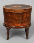 A George III mahogany and satinwood marquetry inlaid oval cellaret and stand
The oval hinged top