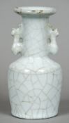 A Chinese porcelain crackle glaze twin handled vase
With flared rim.  22 cm high.