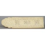 A Chinese Canton carved ivory cribbage board
Profusely worked with figural vignettes amongst