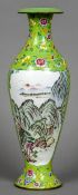 A Chinese Canton enamel vase
Decorated with landscape vignettes within lotus strapwork on a green