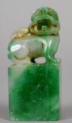 A Chinese carved jade seal
Carved with a dog-of-fo.  6 cm high.