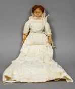 A 19th century wax headed doll
In original costume, the arms and legs also wax.  39 cm long.