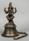 An Indian cast bronze temple bell
Surmounted with the figure of Ganesh with suspension chain.