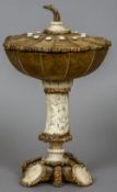 A 19th century carved antler cup and cover
The removable segmented domed cover above segmented bowl