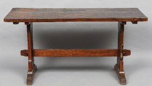 A Wilf "Squirrelman" Hutchinson adzed oak refectory table
The rectangular top supported on solid