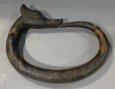 A Chinese carved hardstone Ouroboros
Drilled for suspension.  23.5 cm wide.