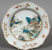 An 18th century Chinese famille rose dish
Decorated with figures and pagodas amongst a mountainous
