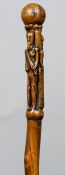 A 19th century carved folk art walking stick
The handle carved with two regal figures.  112 cm high.