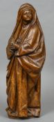 An 18th century carved wood figure of Mary Magdalene, probably Continental
Typically worked.