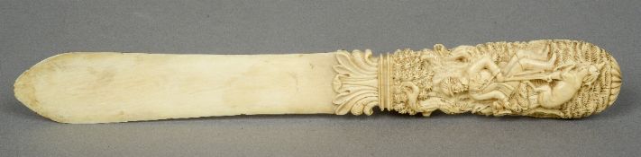 A 19th century carved Dieppe ivory page turner
The handle extensively carved with a huntsman,