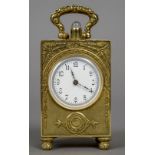 A miniature 935 silver gilt repeating carriage clock
The case with cast foliate decoration,