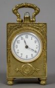 A miniature 935 silver gilt repeating carriage clock
The case with cast foliate decoration,