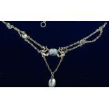 An unmarked silver Arts & Crafts necklace
Set with moonstones.  39.5 cm long.