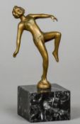 An Austrian gilt bronze figure of a female dancer
Standing on a marble plinth base.  15.5 cm high.