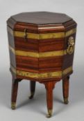 A 19th century mahogany cellaret
Of hinged octagonal form,