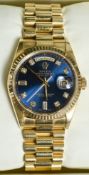 A boxed 18 ct Rolex Oyster Perpetual Day Date President gentleman's wristwatch
The blue dial with