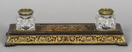 A 19th century boulle desk stand
Of spreading rectangular form,