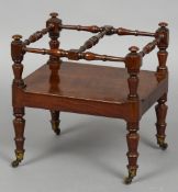 An unusual Victorian mahogany Canterbury
The twin sections divided with turned stretchers above a