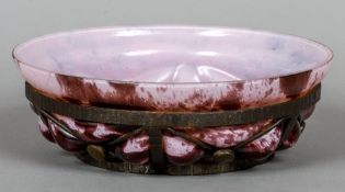 A Daum-Majorelle wrought metal mounted blown glass dish
The glass mottled purples, unsigned.