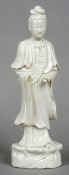 A Chinese blanc de chine porcelain figure of Guanyin
Typically modelled.  38 cm high.