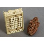 A Chinese Canton carved ivory miniature abacus 
The beads opposing figures in a landscape;