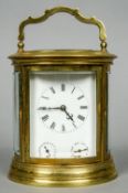 An oval gilt brass cased French striking carriage clock
The white enamel dial with Roman numerals,