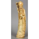 A Chinese carved ivory tusk figure of Shao Loa
Typically modelled in flowing robes holding a fruit