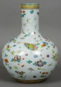 A Chinese porcelain baluster vase
Decorated with floral sprays interspersed with butterflies,