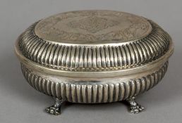 A 19th century Continental silver trinket box and cover
Of oval form, with gadrooned body,