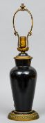 A Chinese famille noir porcelain vase, converted to a lamp
57 cm high overall.