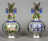 A pair of late 19th/early 20th century Chinese Export silver and enamel twin handled vases
Of