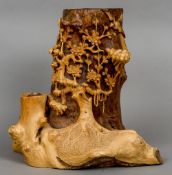 A large Chinese carved root wood brush pot
Naturalistically carved with a flowering prunus tree.