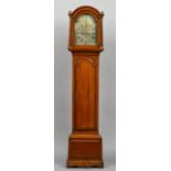 A George III oak cased eight day bell striking longcase clock
The silvered arched 12 inch dial with