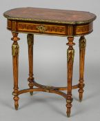 A Victorian ormolu mounted marquetry inlaid ladies dressing table
The hinged shaped top inlaid with