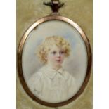 An unmarked yellow metal portrait miniature of a young child
With curly blond hair, monogrammed RCW,