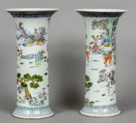 A pair of Chinese porcelain vases
Each decorated with figures and deer in a continuous landscape,