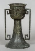 A Chinese archaistic style bronze vase
The upper bowl section inlaid with a band of unmarked silver