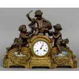 A bronzed art metal Sevres type porcelain inset mantel clock
The 3 1/2 inch white enamel dial with