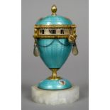 An enamel decorated unmarked silver gilt egg shaped clock
Decorated with various figural vignettes.