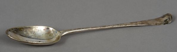 An 18th century silver serving spoon, hallmarked London, date letter indistinct, maker's mark of E.