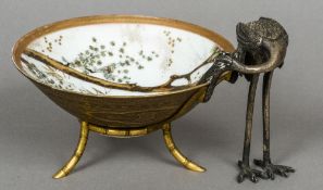 A late 19th century Japanese porcelain bowl
Mounted on an ormolu and silver plated stand formed as